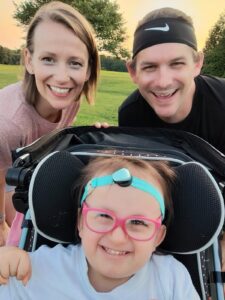 Izzie at 3 with her parents