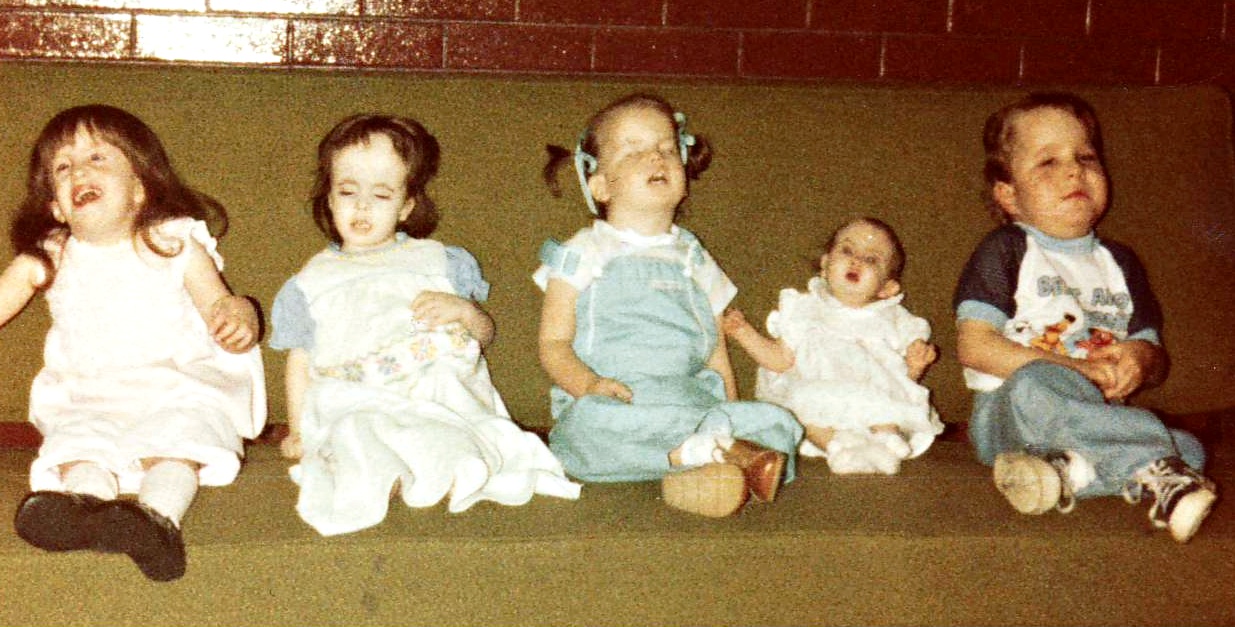 Five children with trisomy 18 seated together at the First Gathering, Salt Lake City, May 1980. Left to right: Rachael Watson, Kari Holladay, Brandy Woodcox, Kimberly Richins, and Tannyn Person.