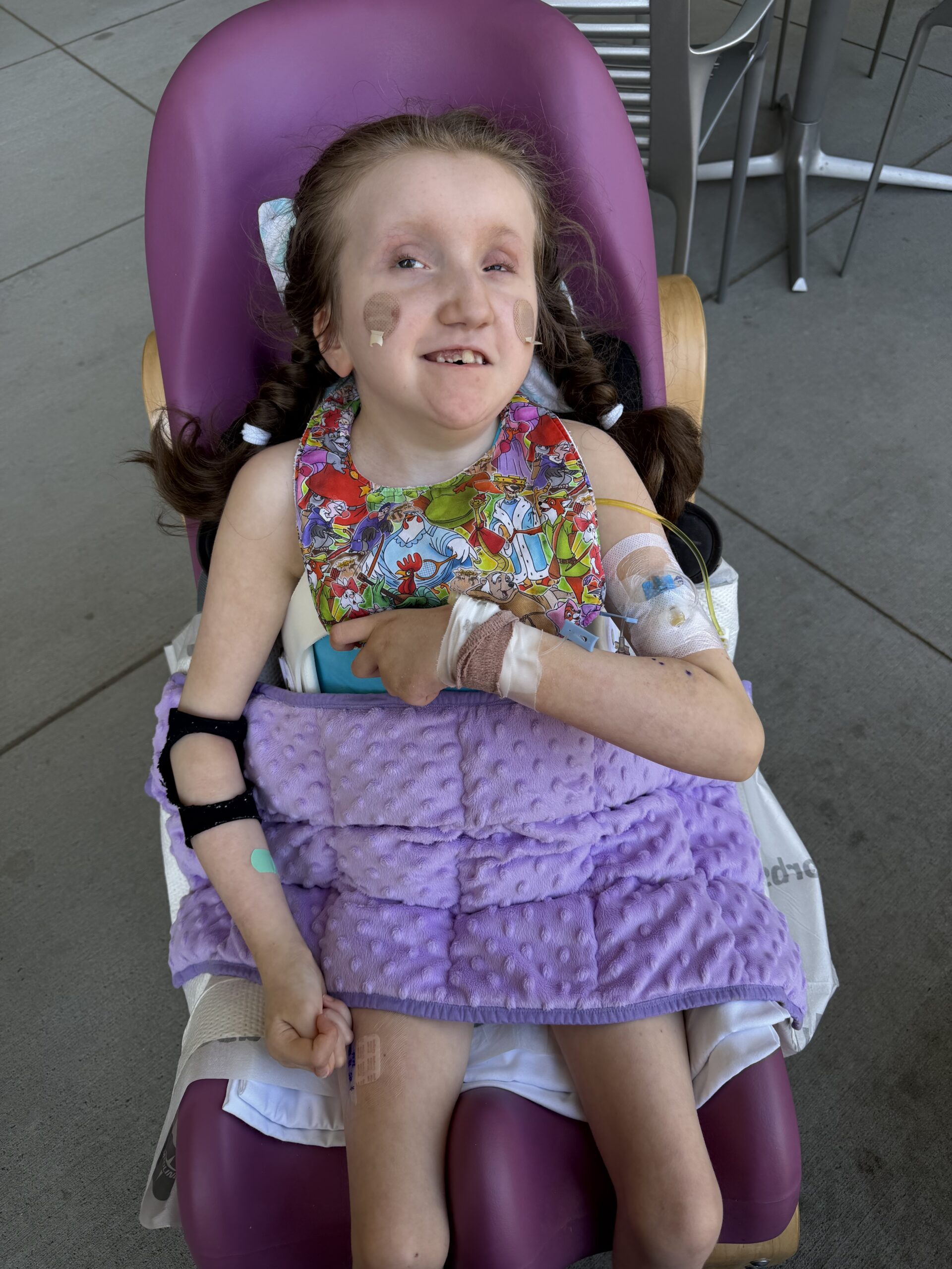 Ivy, who has Trisomy 9 Mosaic, smiling