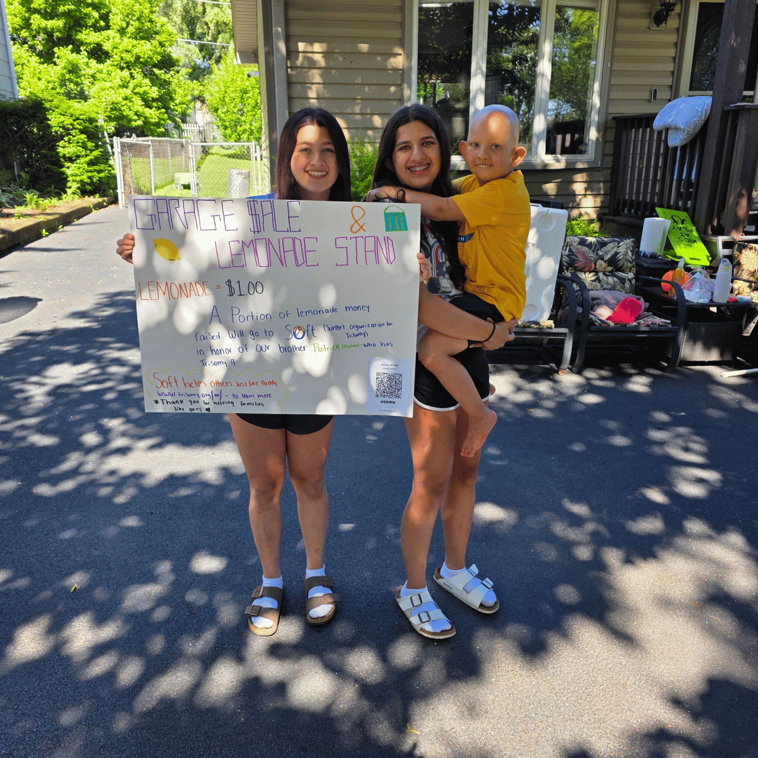 Ariana and Sophia Jerzyk with their handmade lemonade stand sign