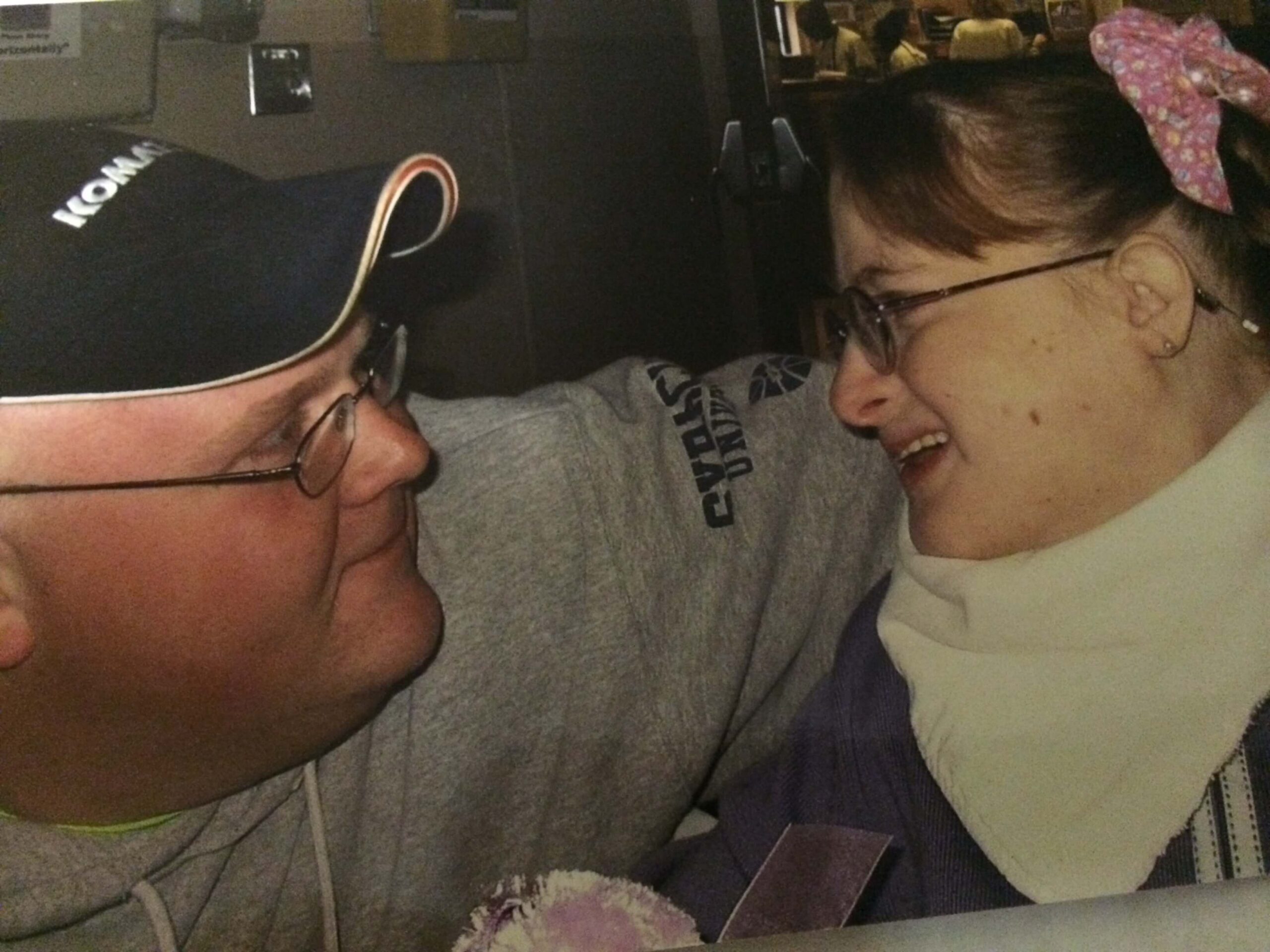 Stacy VanHerreweghe later in life Trisomy 18 Edwards syndrome smiling in pink