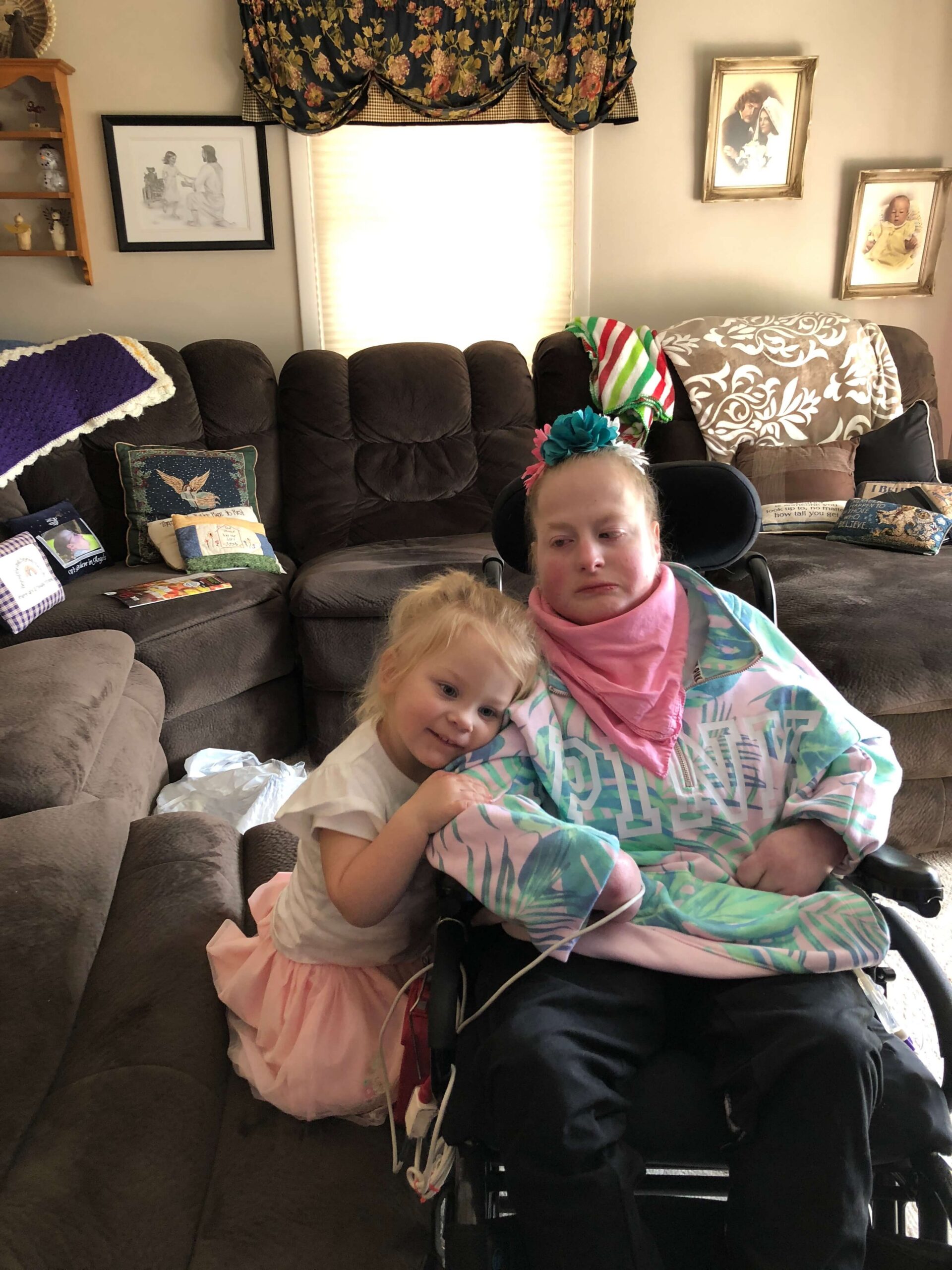 Barb VanHerreweghe and Stacy VanHerreweghe together Trisomy 18 family