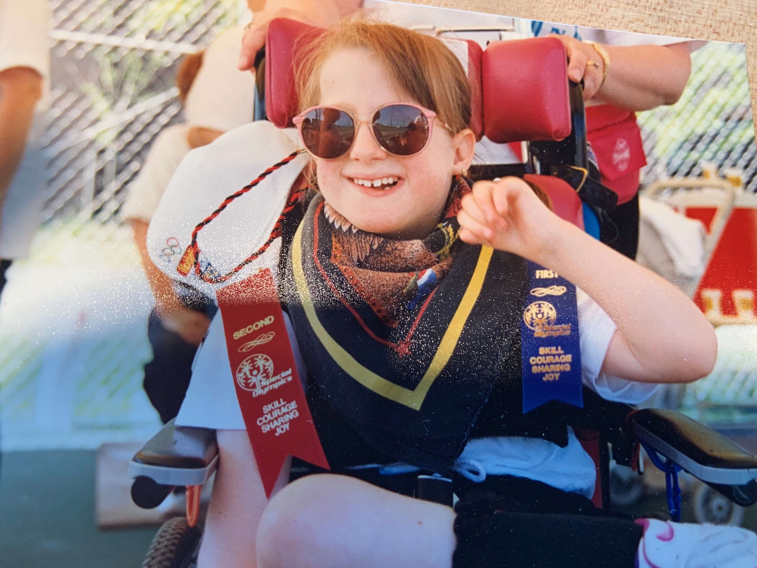 Stacy VanHerreweghe Trisomy 18 at conference or family gathering in pink