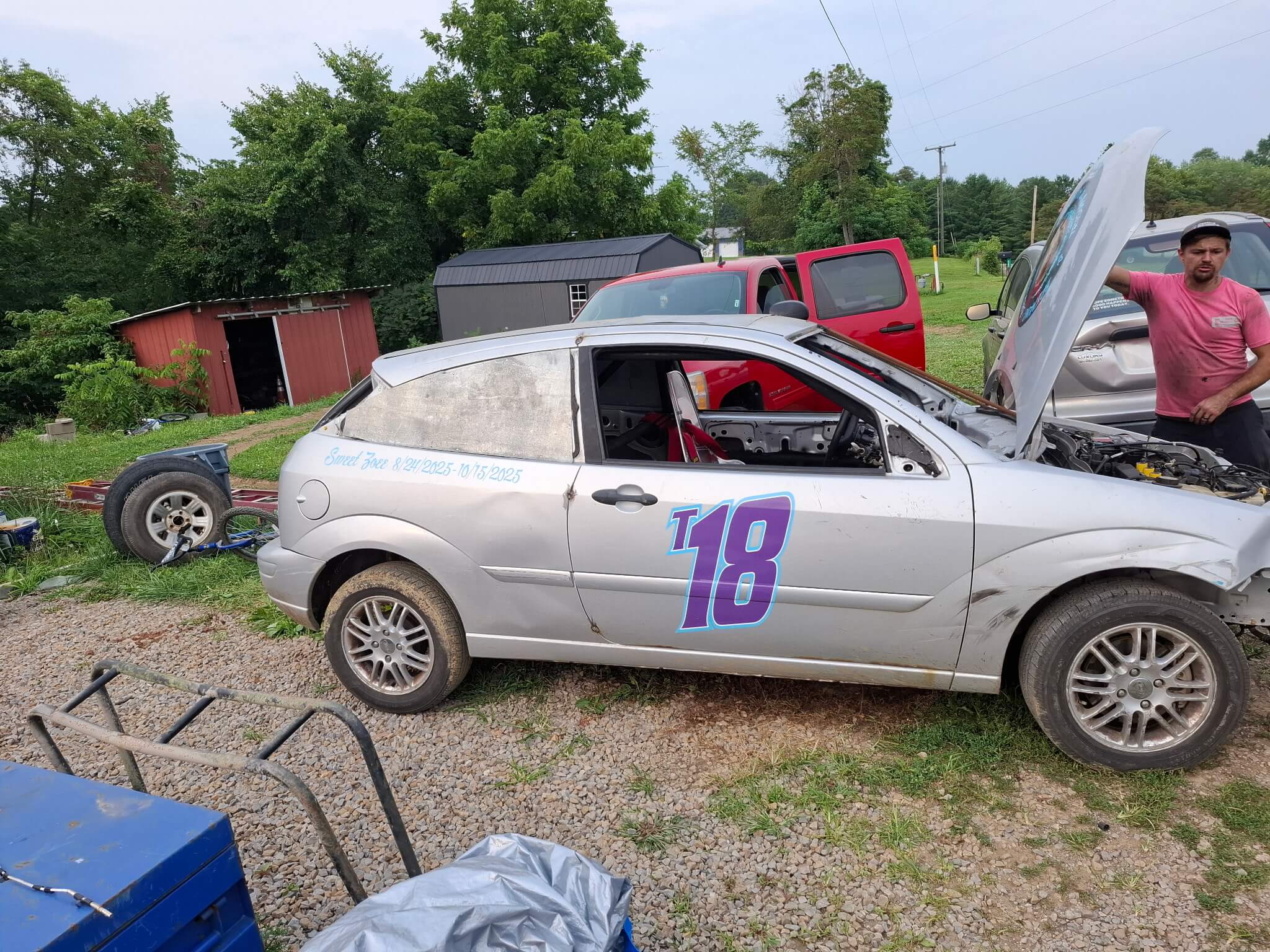 Sarah Wisecarver racing car E18 on the dirt track for Trisomy 18 Edwards syndrome awareness